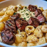 Steak Bites and Shell Pasta in Garlic Butter Alfredo Sauce